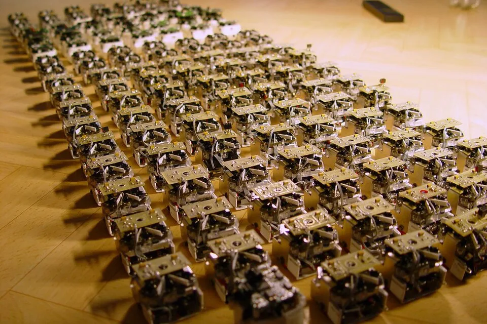 A swarm of small robots arranged in rows